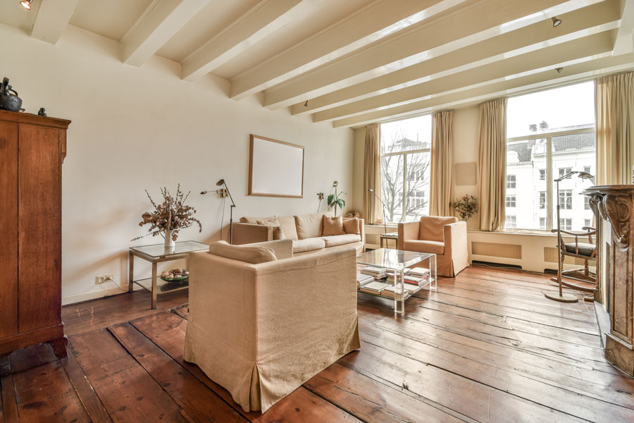 Bright living room in an older home with painted surfaces that may contain hidden lead paint layers