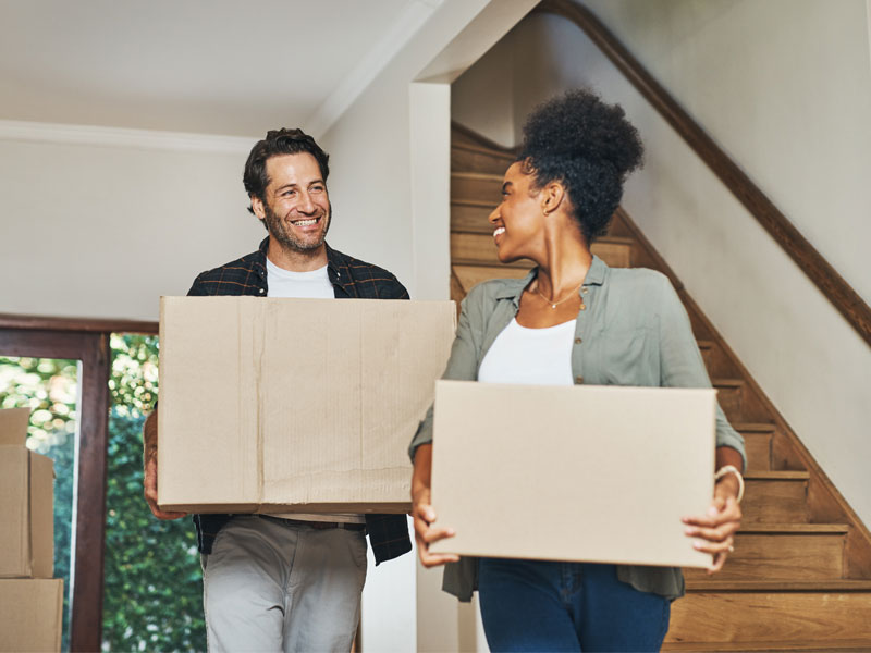 Homebuyers moving into a new house where radon testing is recommended before occupancy