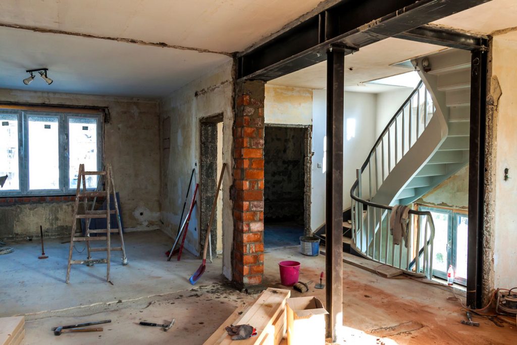 Older home undergoing renovation where an environmental risk assessment may identify lead-based paint, asbestos, mold, or other environmental hazards before construction.