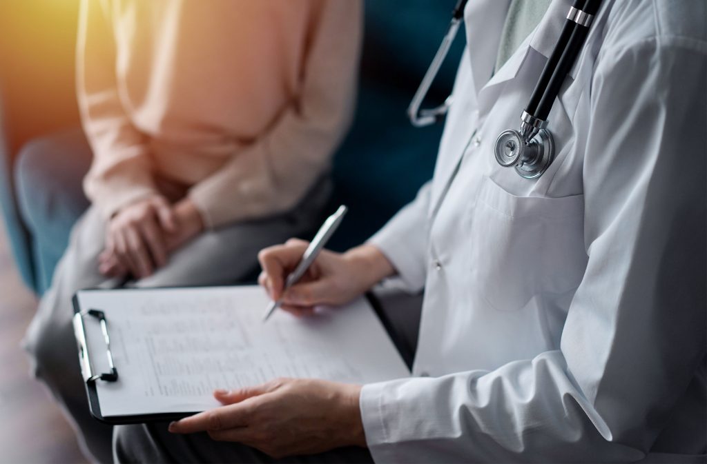 Healthcare professional documenting a lead exposure evaluation related to a DOH lead violation investigation in New York City