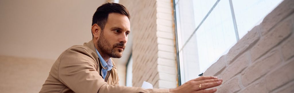 Environmental consultant inspecting a residential property during a DOH lead violation investigation in New York City