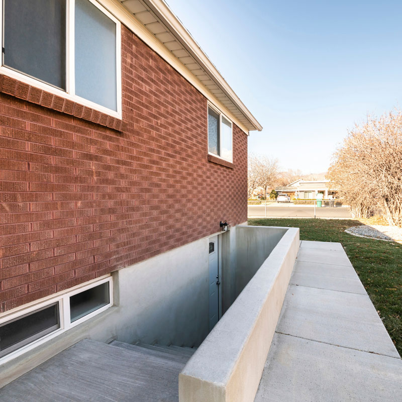 Home foundation and basement entrance illustrating common areas where radon gas can enter through below-grade construction