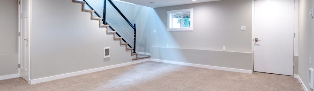 Finished basement showing the lowest level of a home where professional radon testing is commonly performed